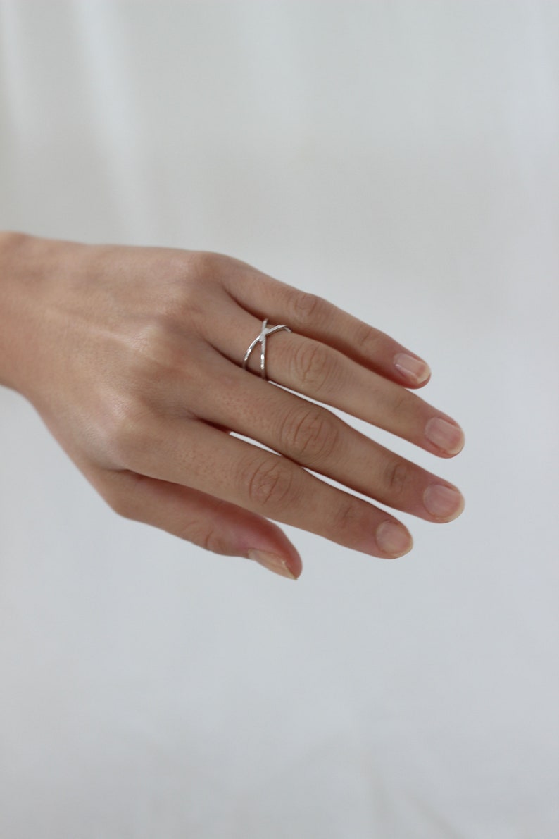 Anillo X ring en plata de ley y baño en oro