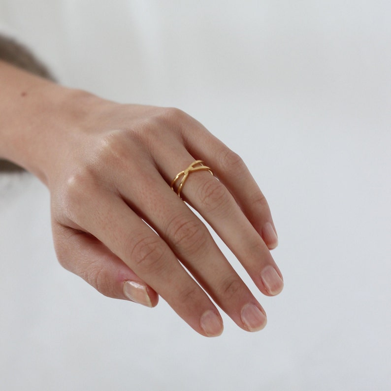 Anillo X ring en plata de ley y baño en oro