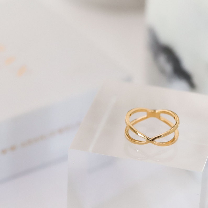 Anillo X ring en plata de ley y baño en oro