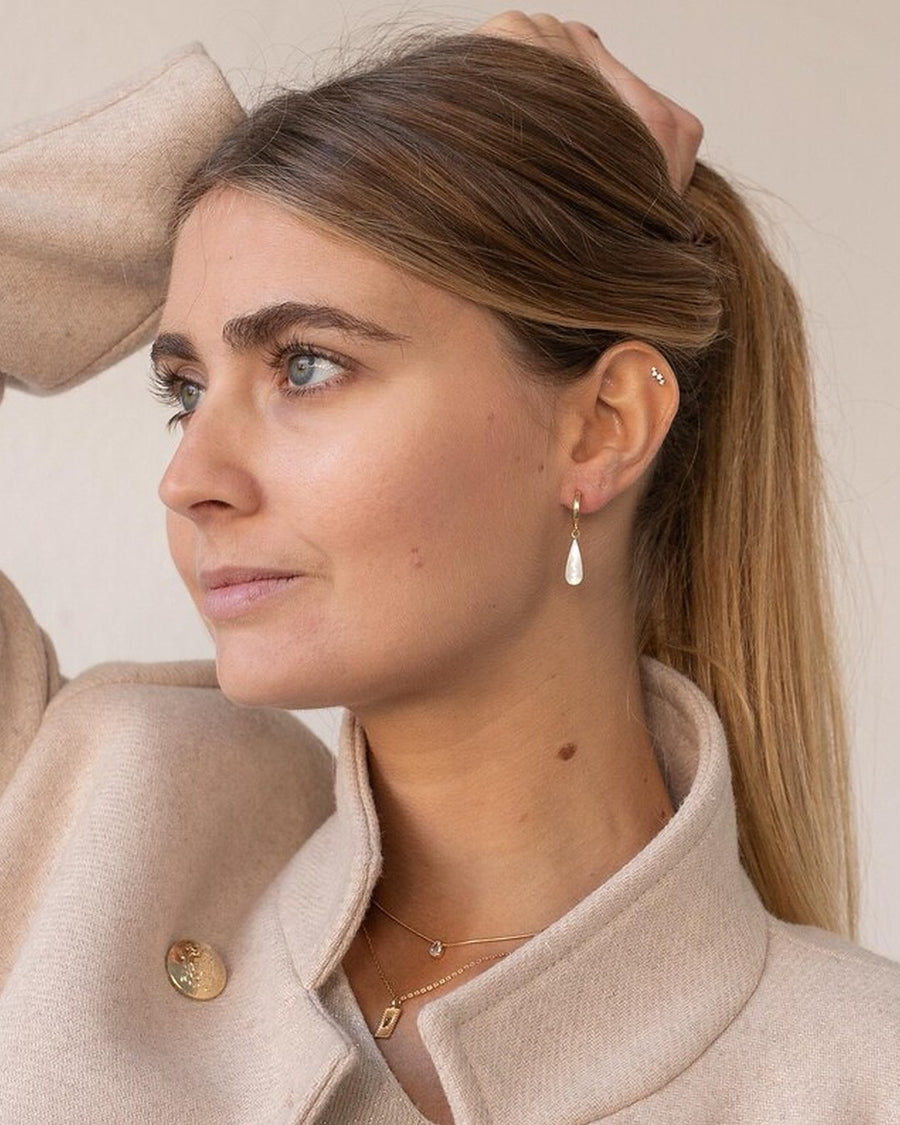Gold mother-of-pearl teardrop pendant earrings
